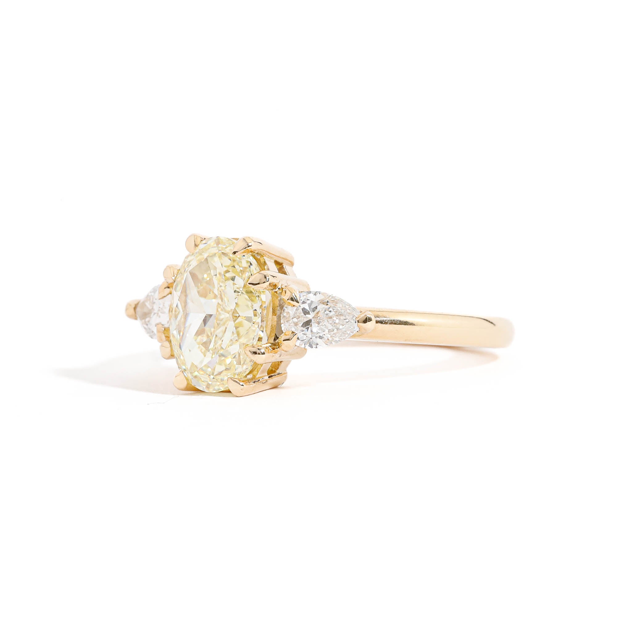 Oval Cut Diamond Ring with Pear Cut Diamond Ring in 18 Carat Yellow Gold