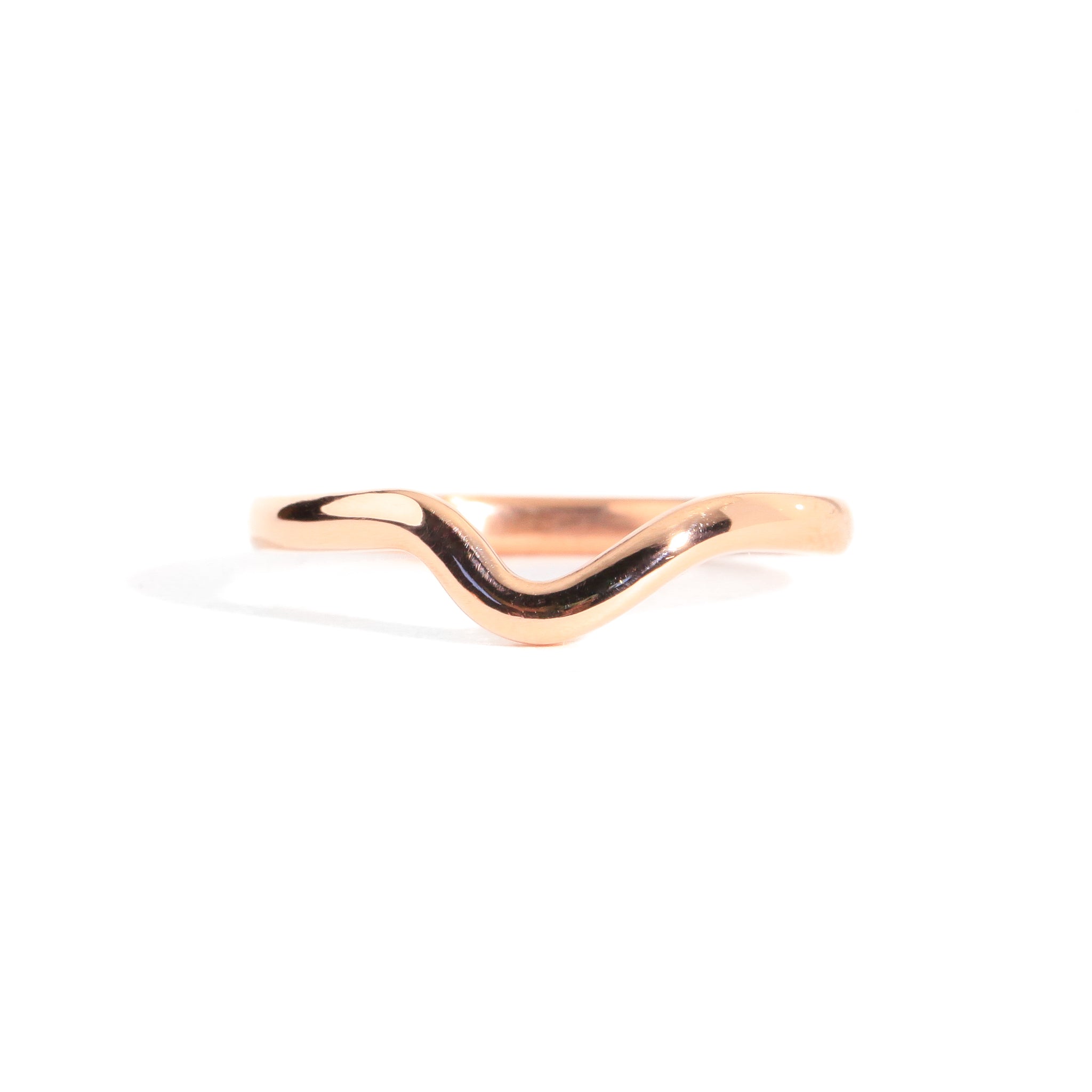 Handmade 18 carat rose gold dimpled band with a polished finish.