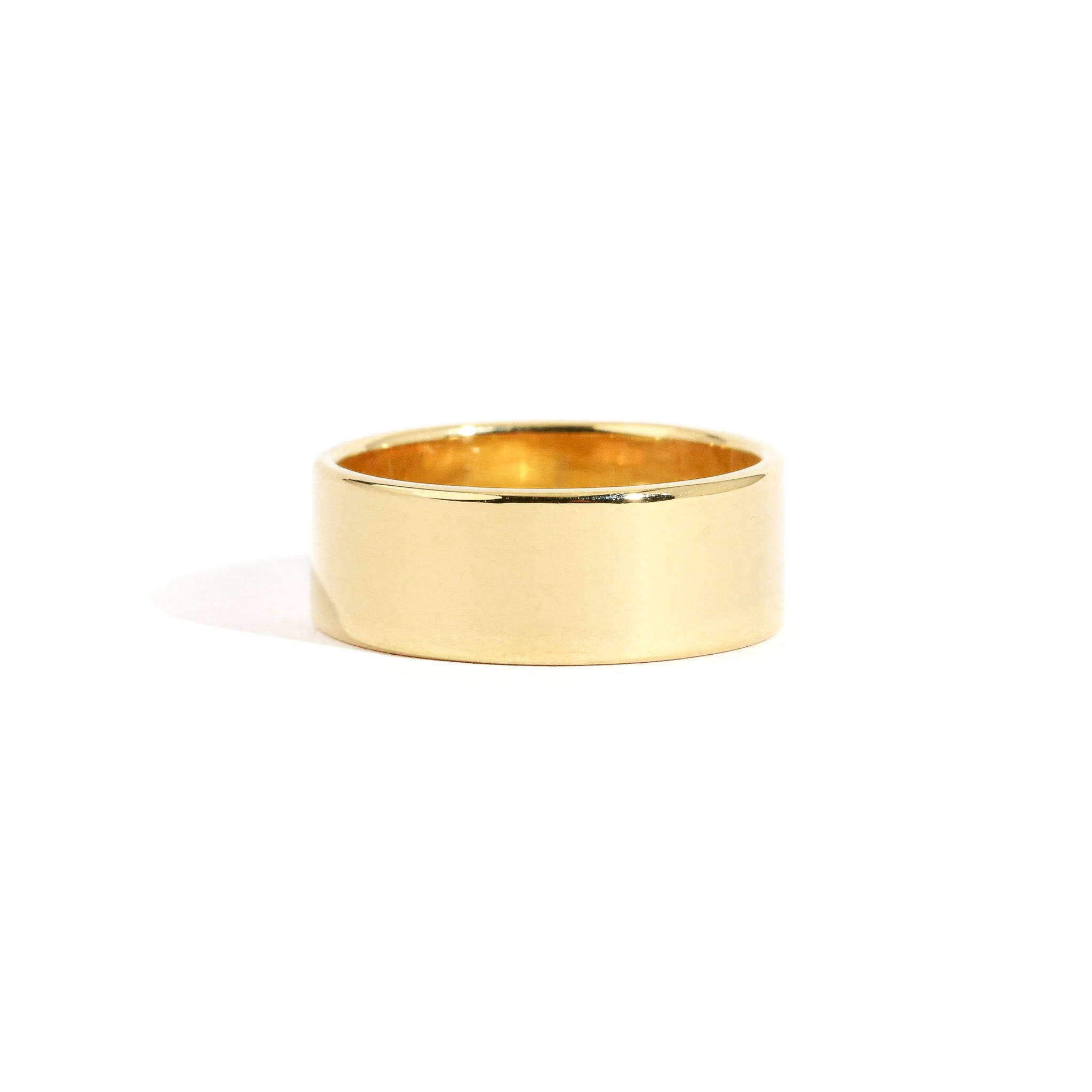 Handmade cigar wedding band, shown in 18 carat yellow gold.