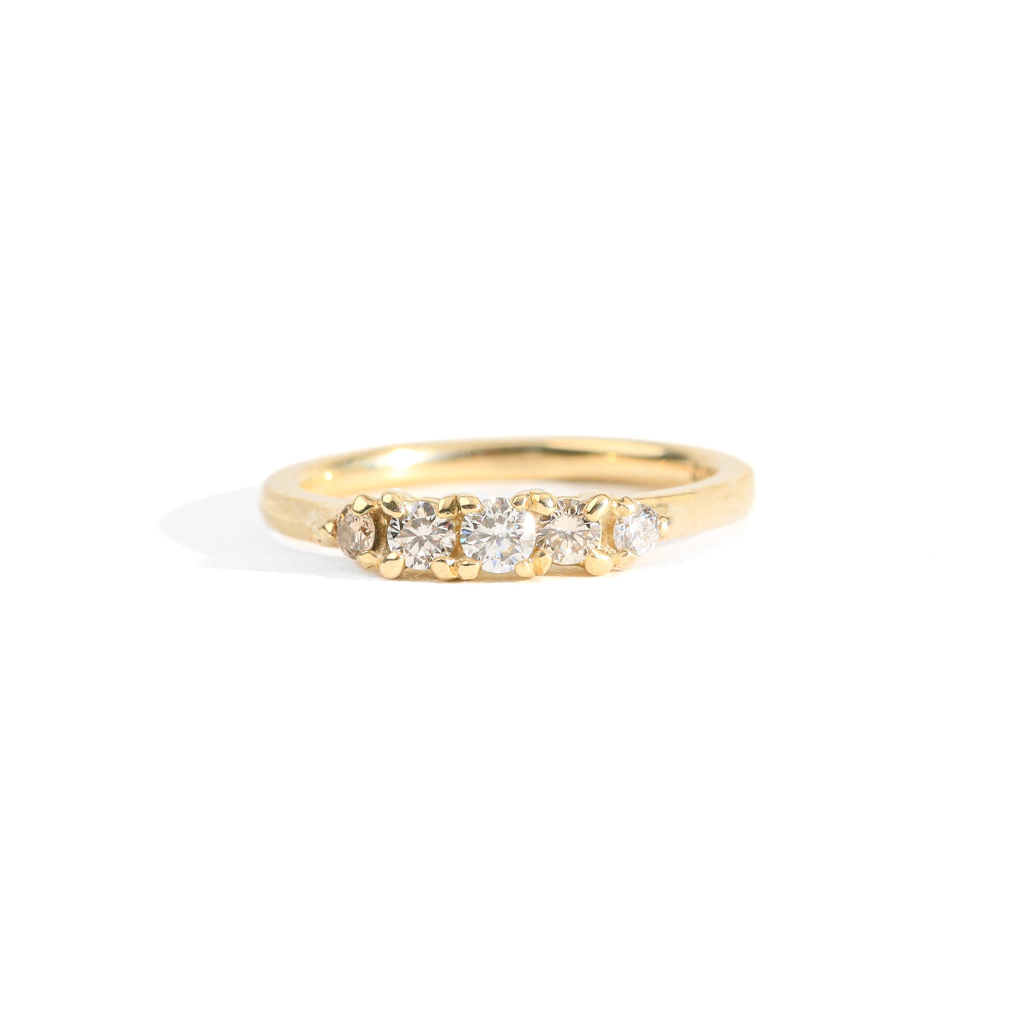 Hand crafted yellow gold five stone champagne diamond ring. 