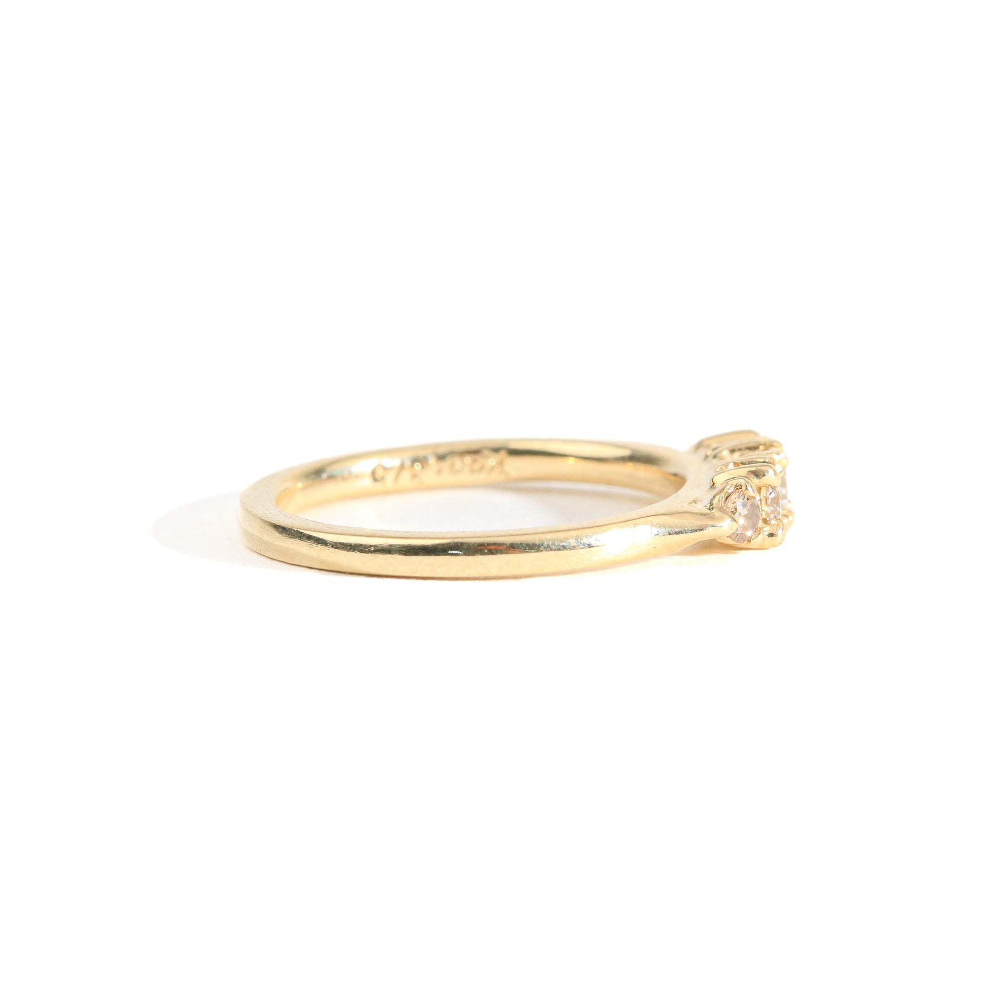 Hand crafted yellow gold five stone champagne diamond ring. 