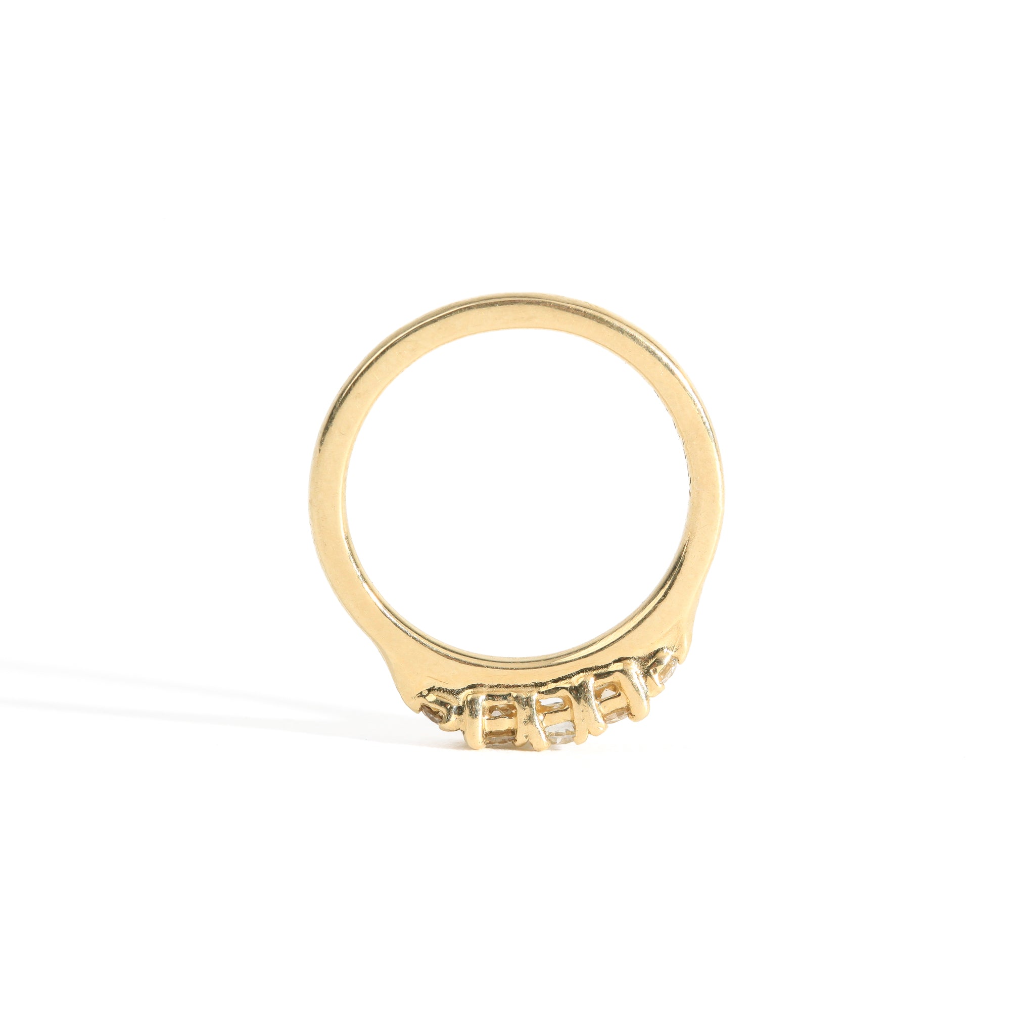 Hand crafted yellow gold five stone champagne diamond ring. 