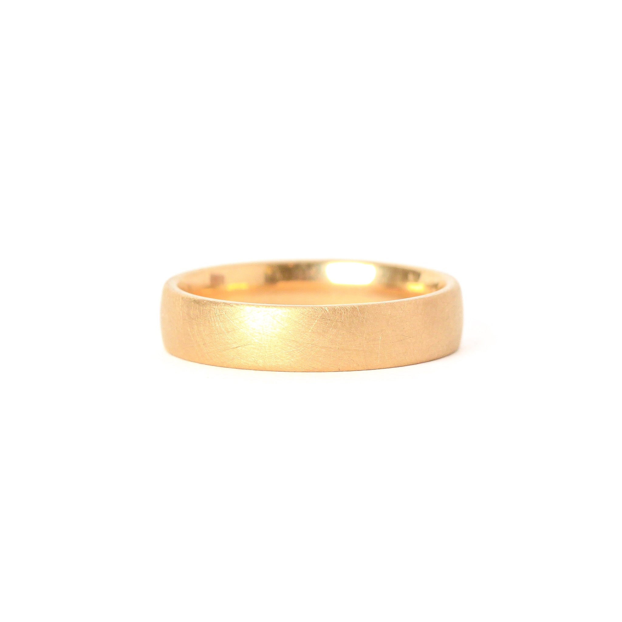 Classic 18 carat yellow gold wedding band with matte, brushed finish.