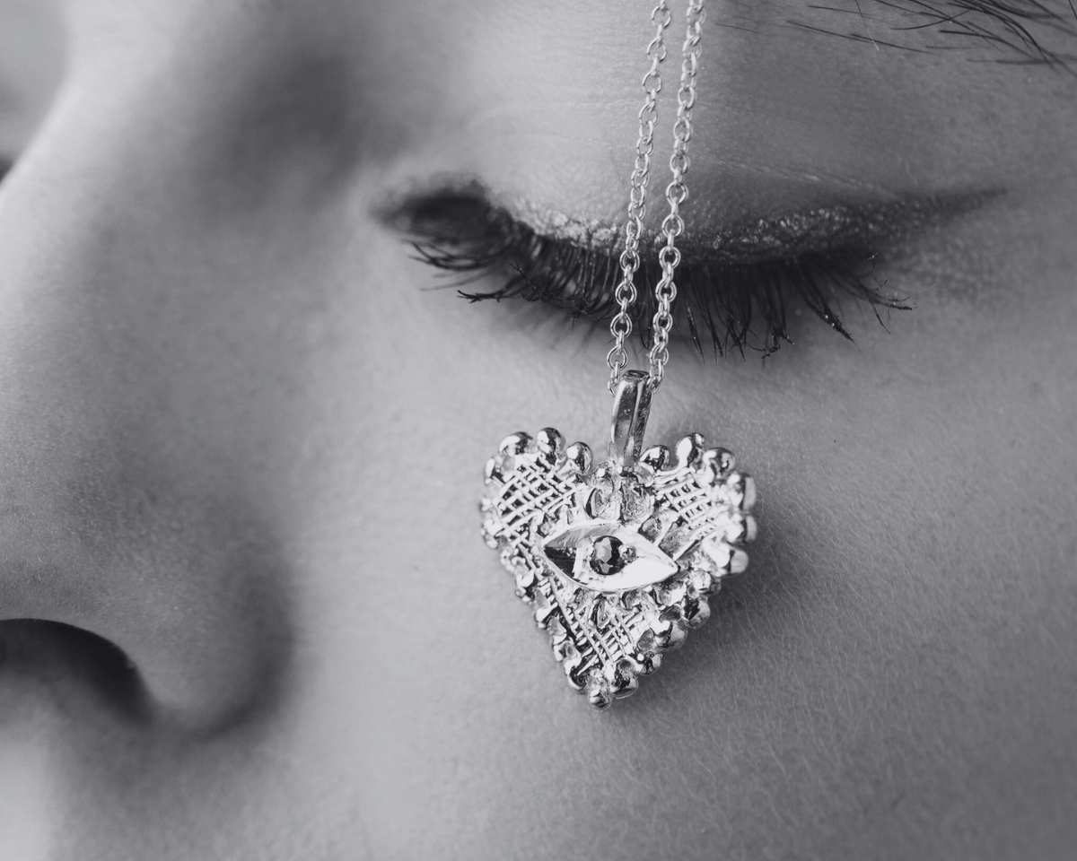 HEART PENDANT ON FACE CLOSE UP