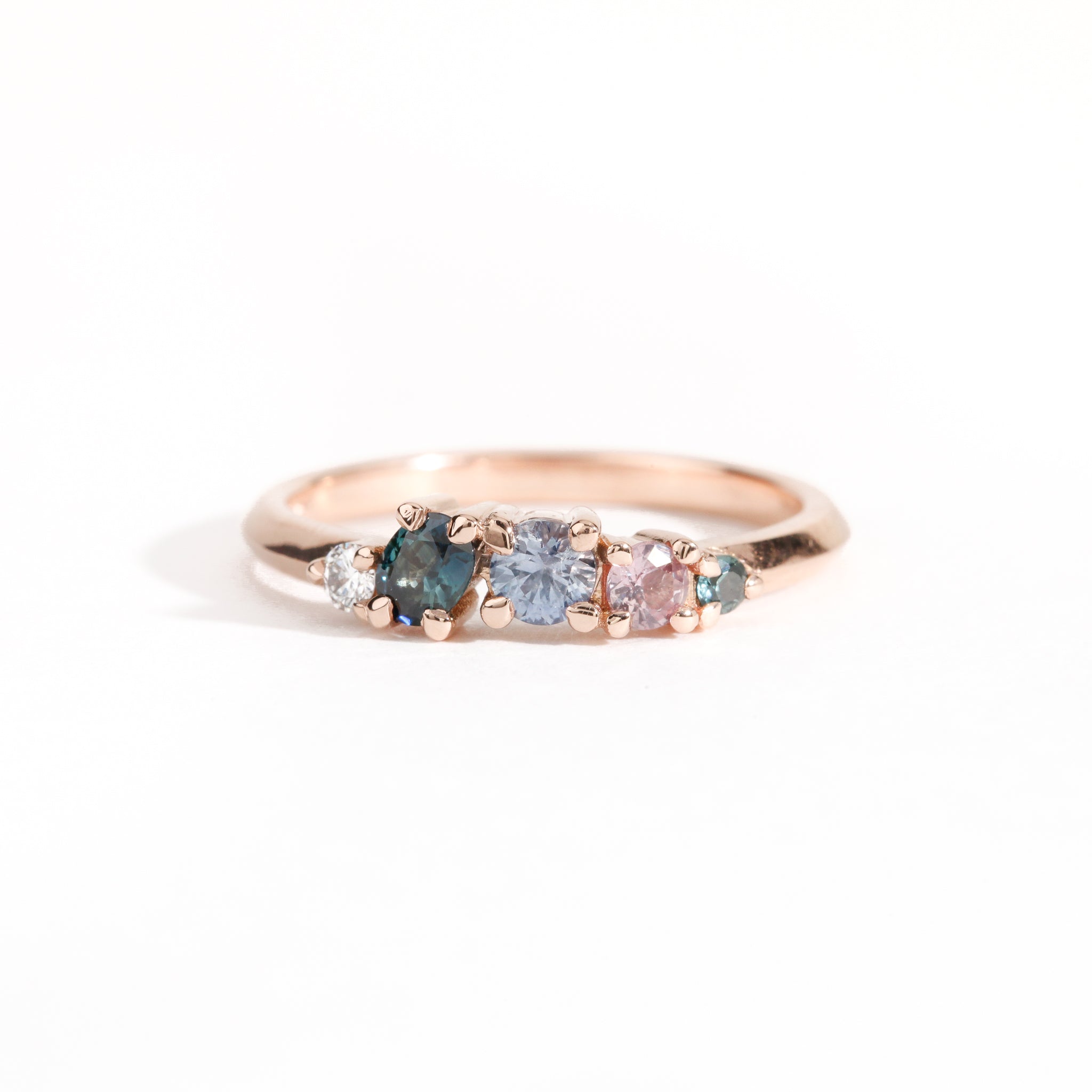 18ct Rose Gold ring set with ethically sourced Australian sapphires in blues and pink hues and a white diamond. Handmade by Black Finch Jewellery Melbourne